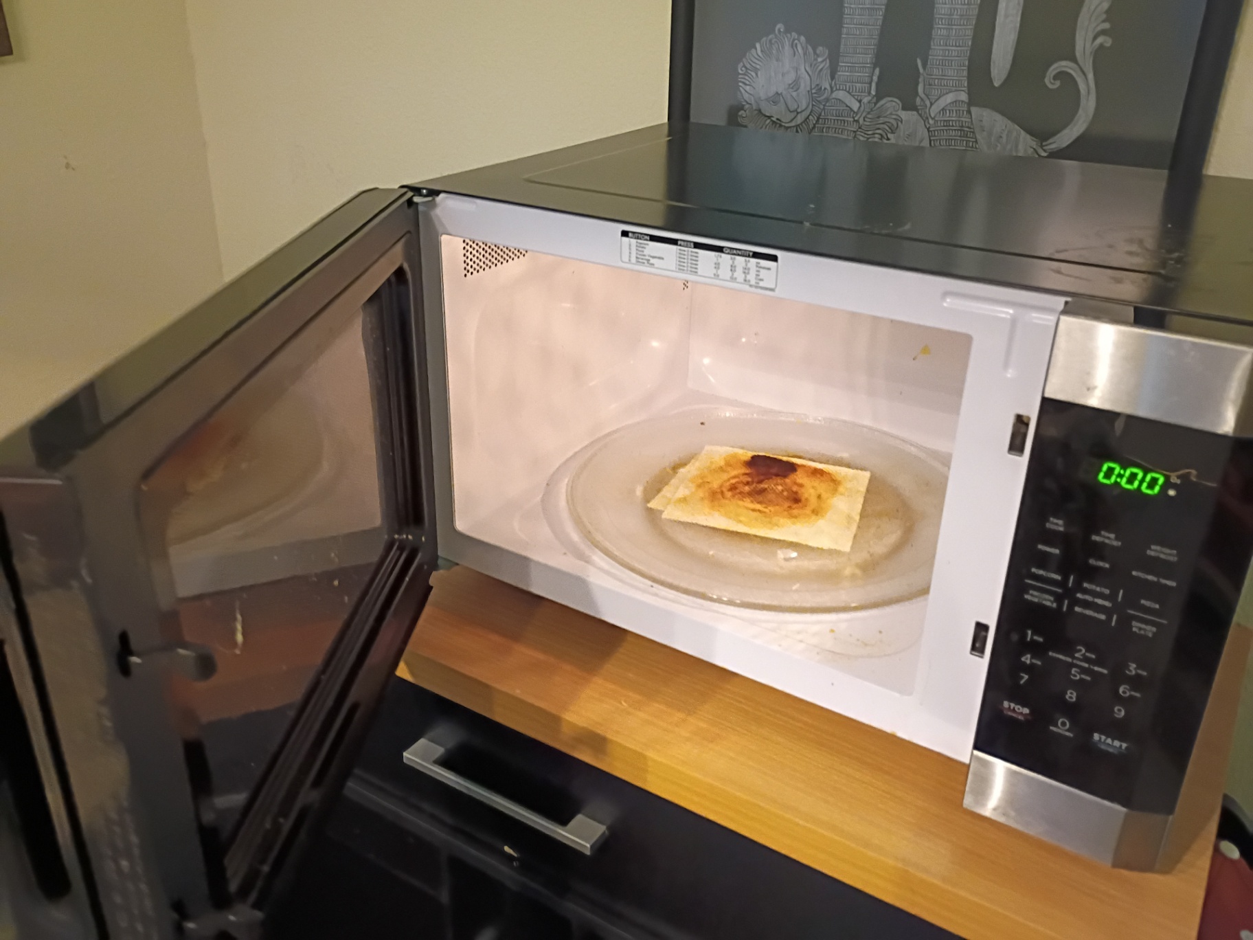 Microwave before cleaning by Nelly Cleaning Service